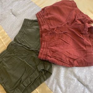 Two pair of Old Navy linen shorts. Colors are olive and burnt red.